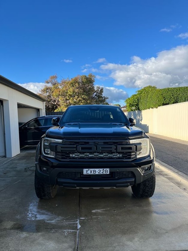 Black Ford Raptor freshly washed and protected