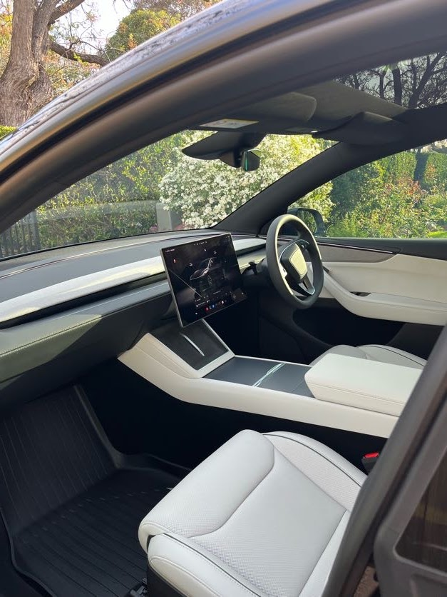 Tesla Model Y interior with white leather after an interior detail